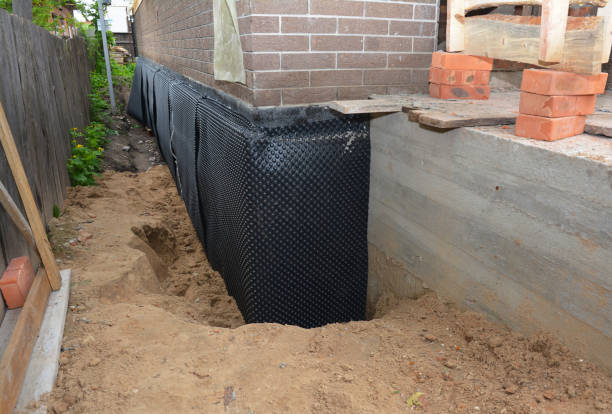 Happy homeowners after waterproofing job in Heiskell